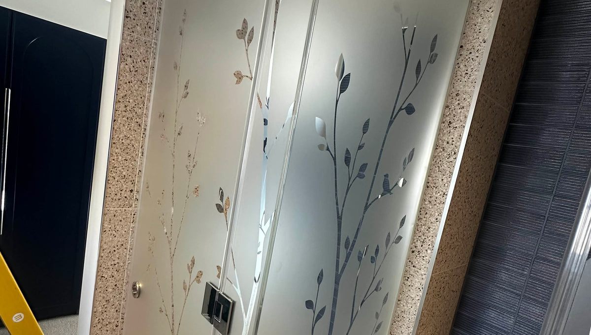 Privacy window film installation with a decorative flourish