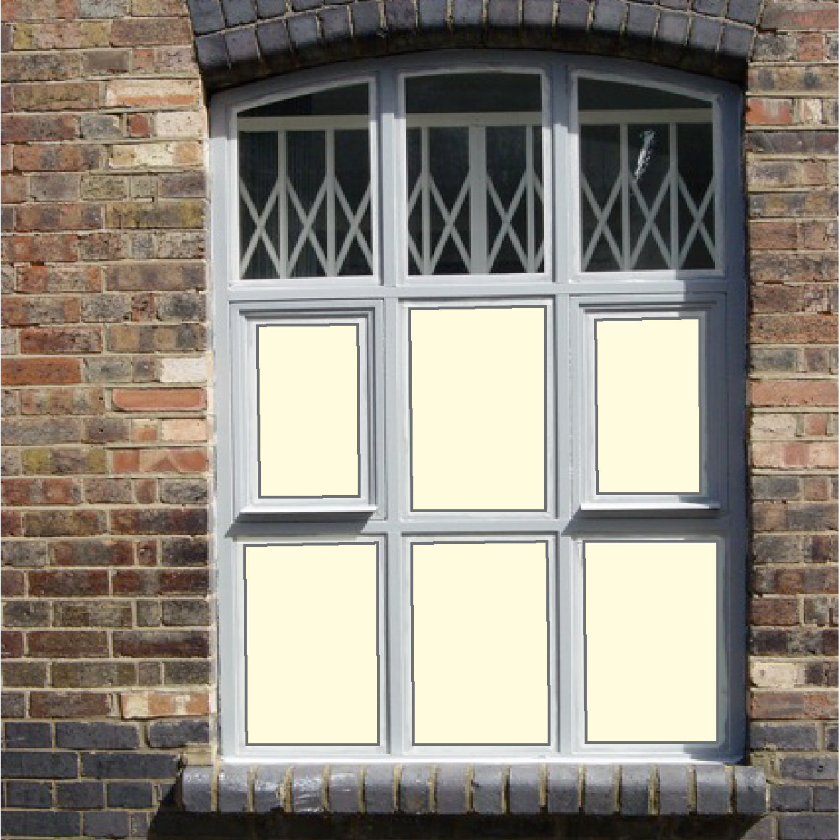 Solid almond coloured window film for decoration and privacy applied to a window with 6 panes.