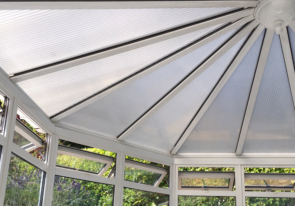 A polycarbonate conservatory roof with Supertint window film fitted.