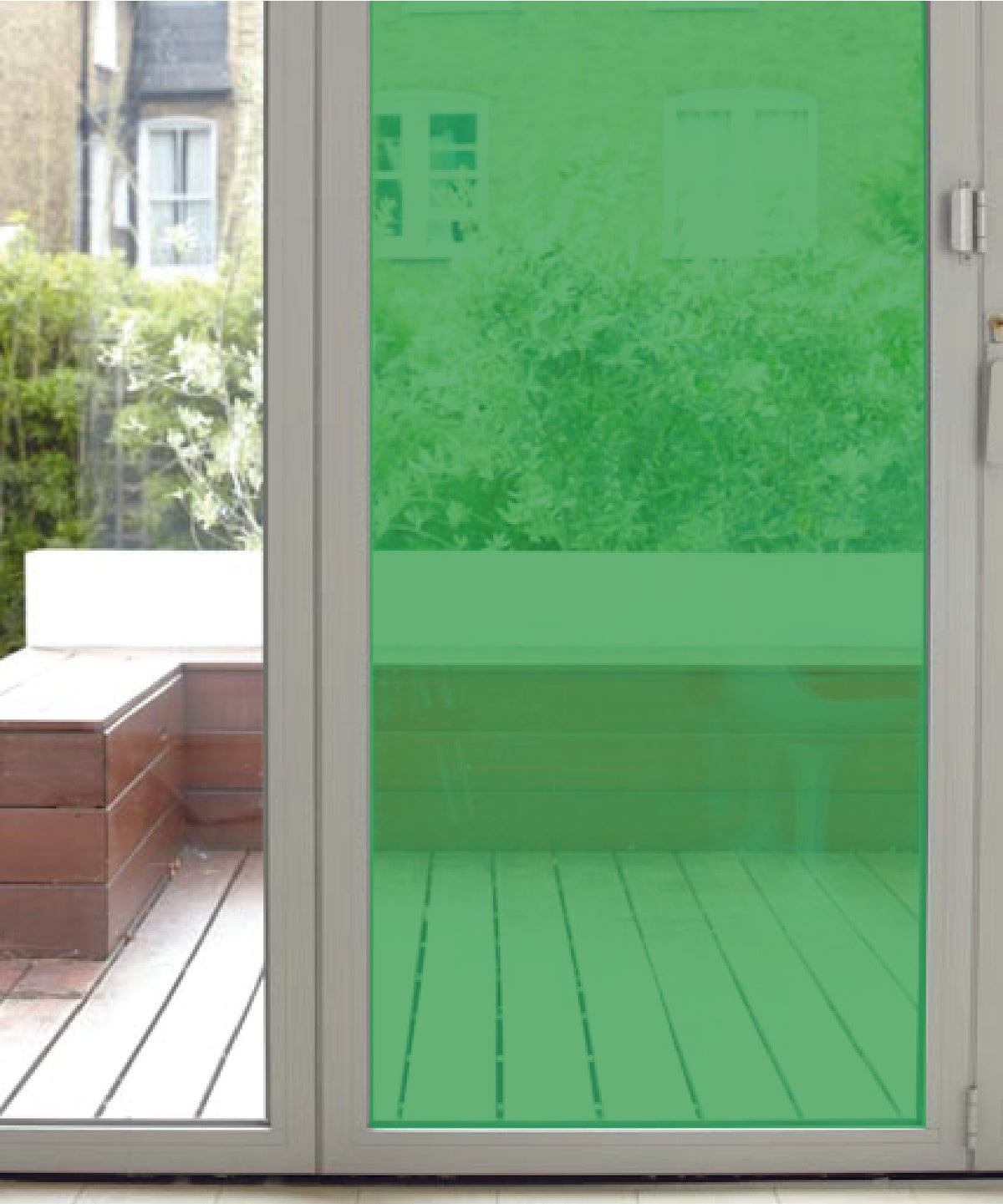 Glass door with green coloured window film on a patio window.