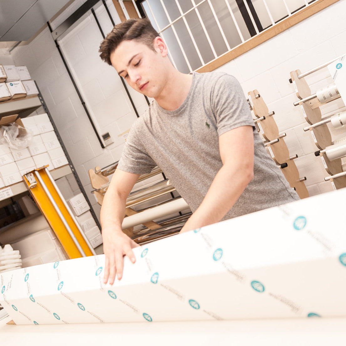 A member of The Window Film Company's team prepares window film ahead of delivery to a customer. 