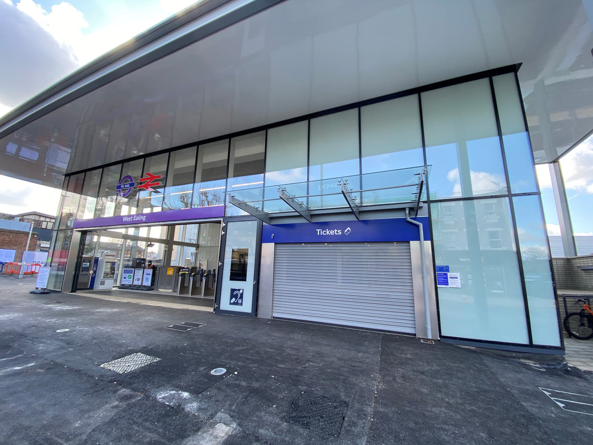 The entrance to West Ealing rails station, with anti-graffiti window film applied to the glazed sections of the frontage. 