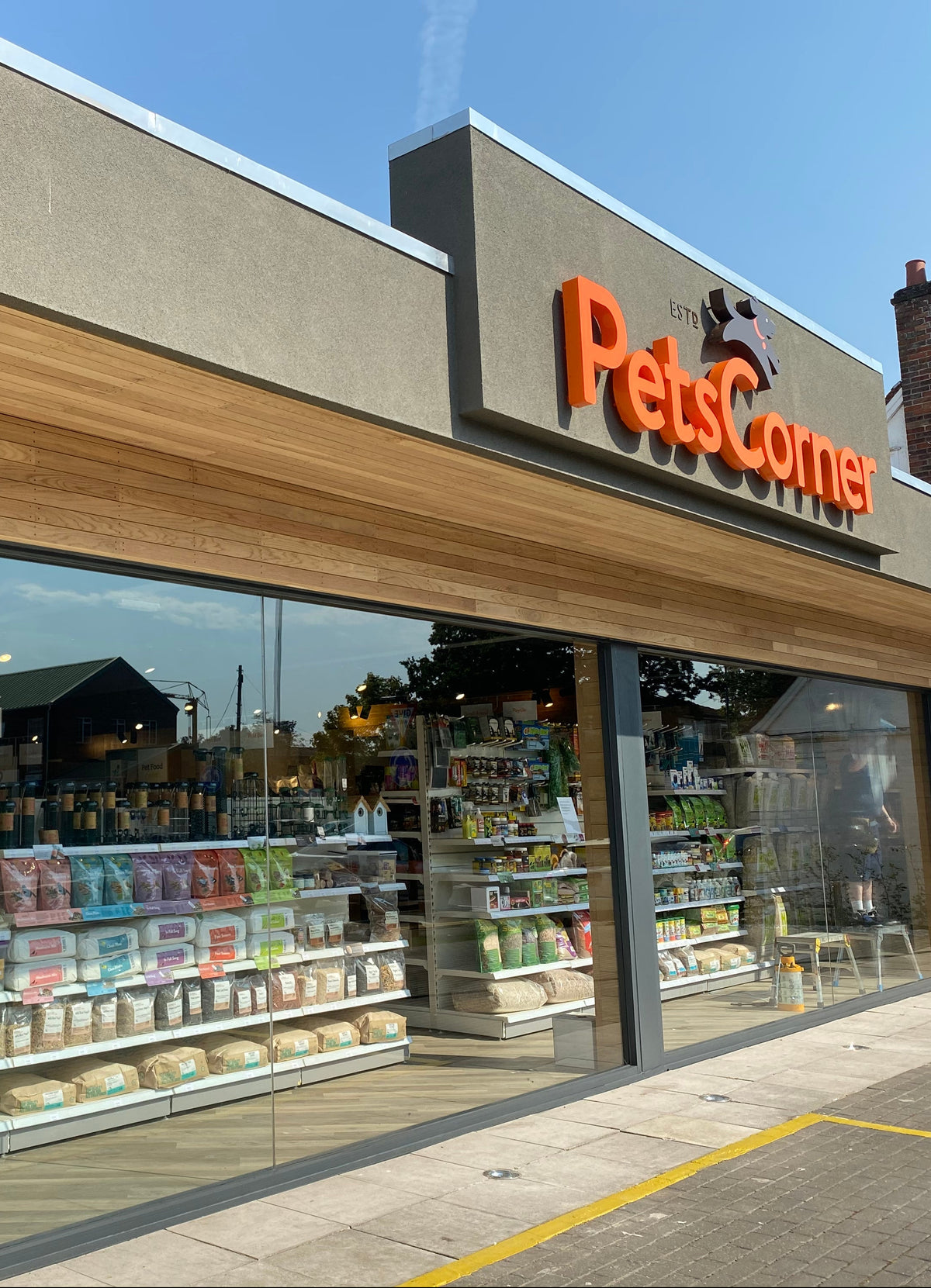 A view of a branch of Pets Corner on a sunny day with Clear UV window film being applied to the internal face of the glazing