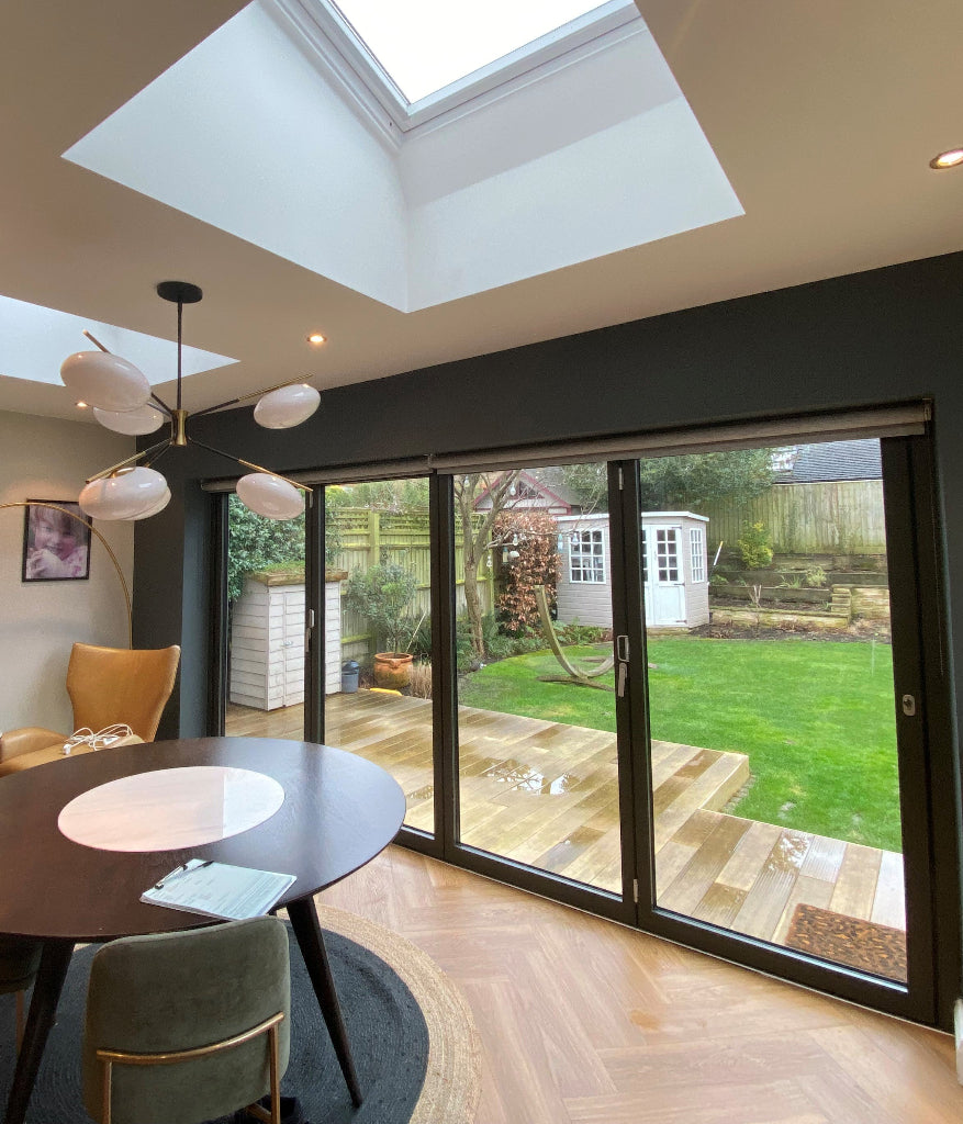 Clear UV protection film applied to the inside of the bifold doors of this house.