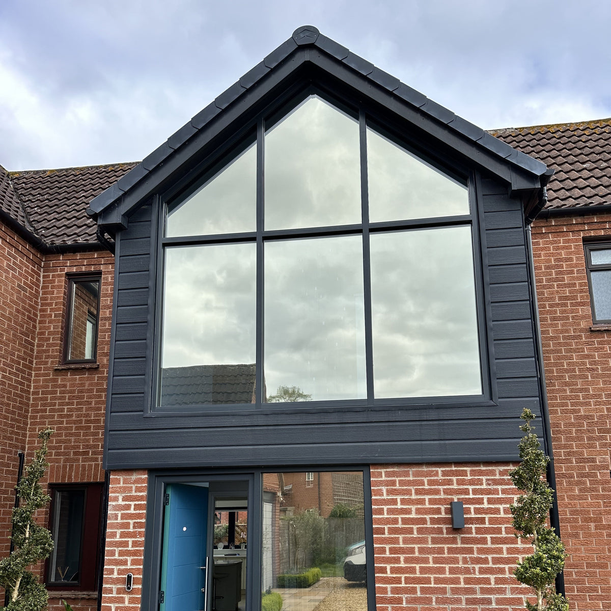 An external view of a shaped window of a modern house which has had Climate 35 solar control window film applied to it.