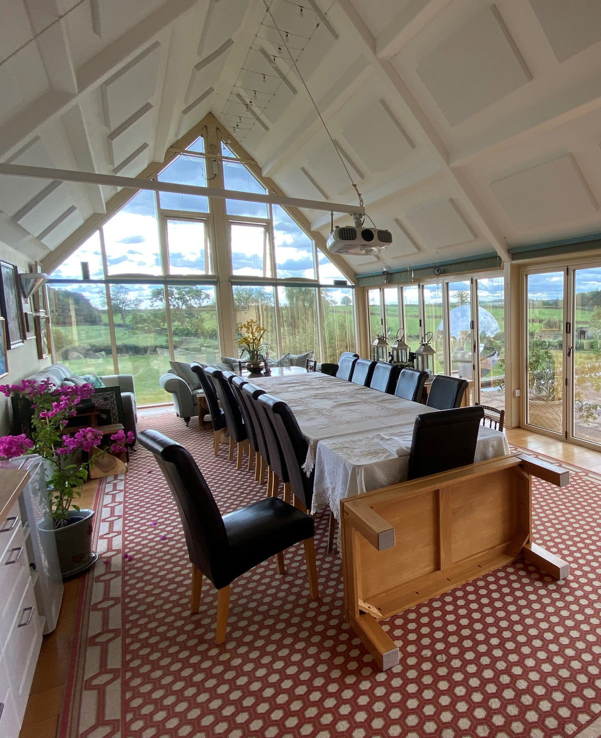 Large dining area with extensive glazed windows; each pane has Climate 50 heat reduction window film applied to it.