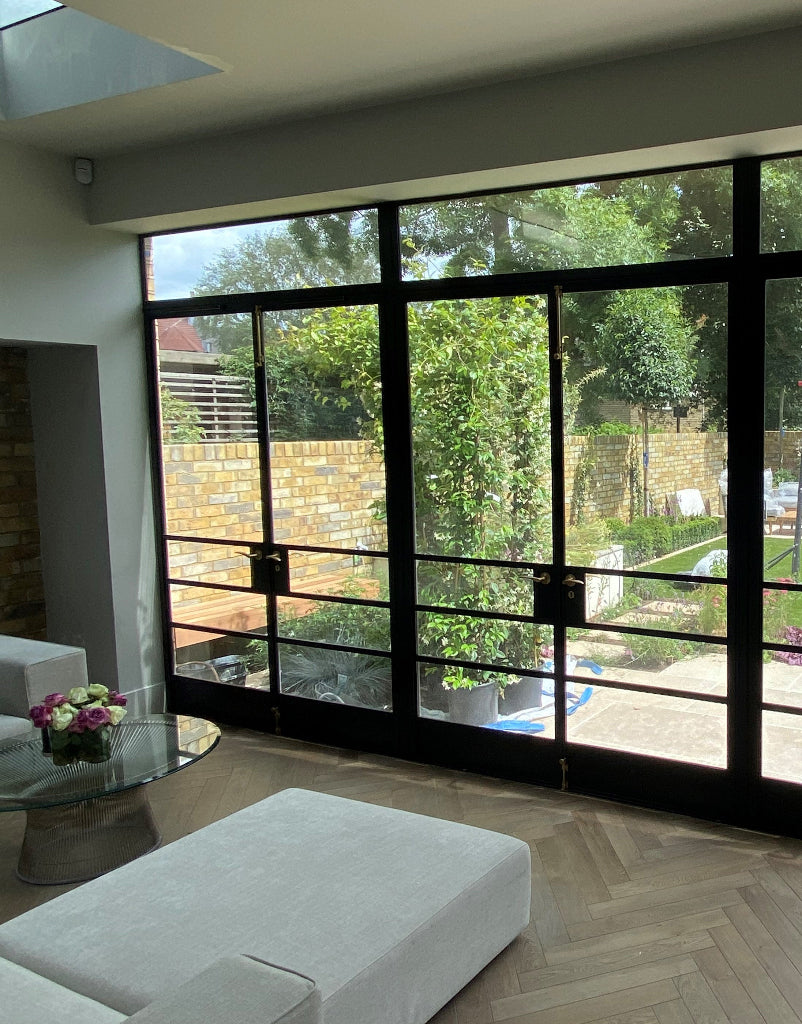 Solar control window film applied to the side patio door windows to reduce heat and glare.