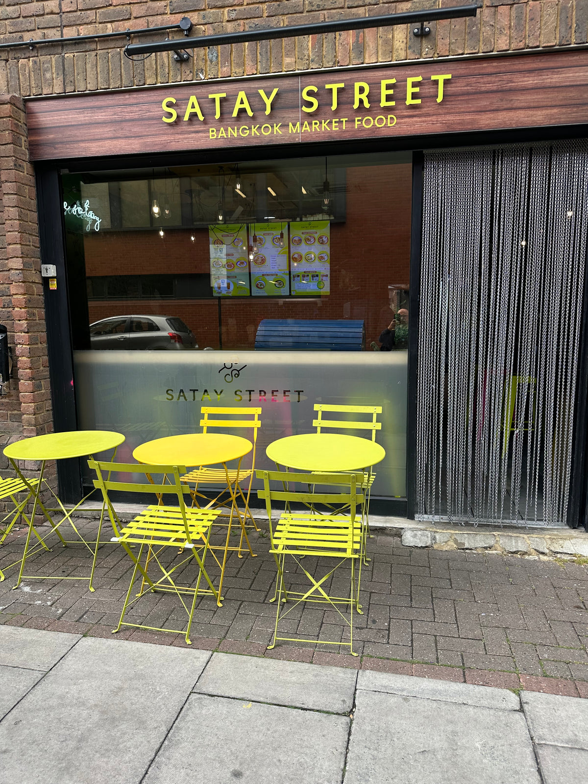 The shop front of a restaurant that has solar control film applied to the window.