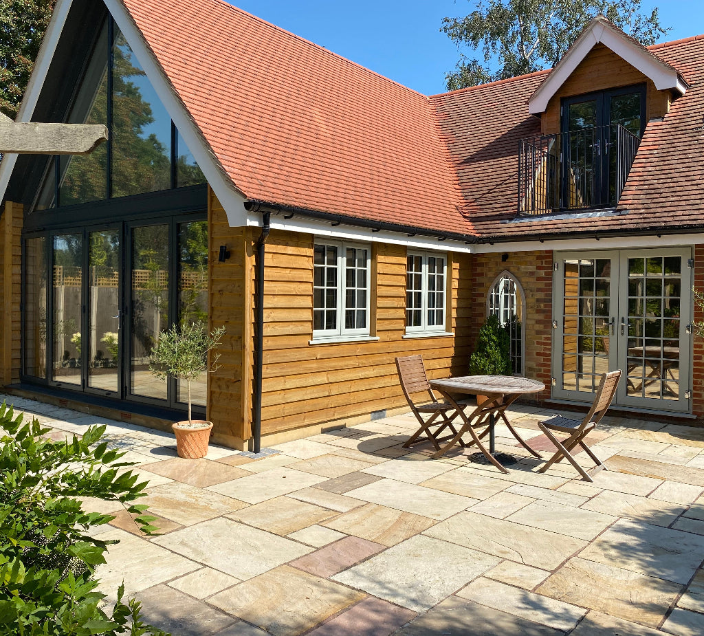 Modern house with solar control window film applied to the different sizes and shapes of windows.
