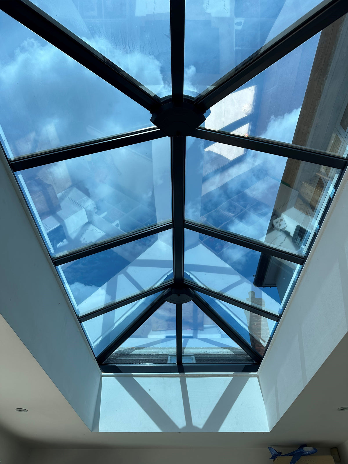 A large glass rooflight with heat reduction window film applied to the internal face of the glazing. 