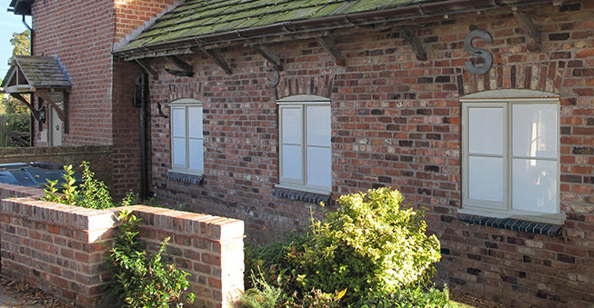 Contra Vision one-way privacy window film applied to the windows of a house to obscure vision.