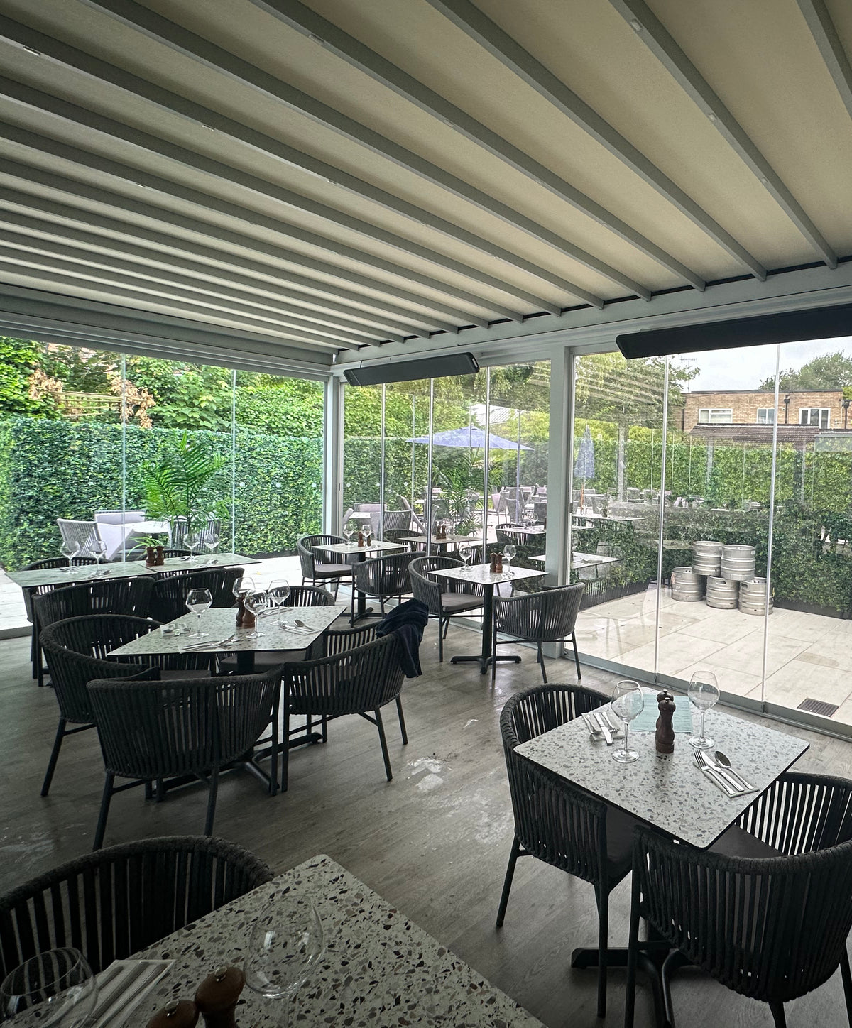 Internal view of a restaurant with floor to ceiling windows which have solar control window film applied, helping to reduce heat while still allowing a view to the outside.