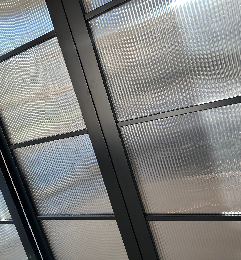 Internal glass door with reeded window film applied.