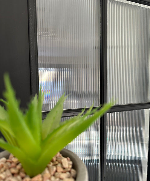 Close up of a window film with reeded window film for decoration.