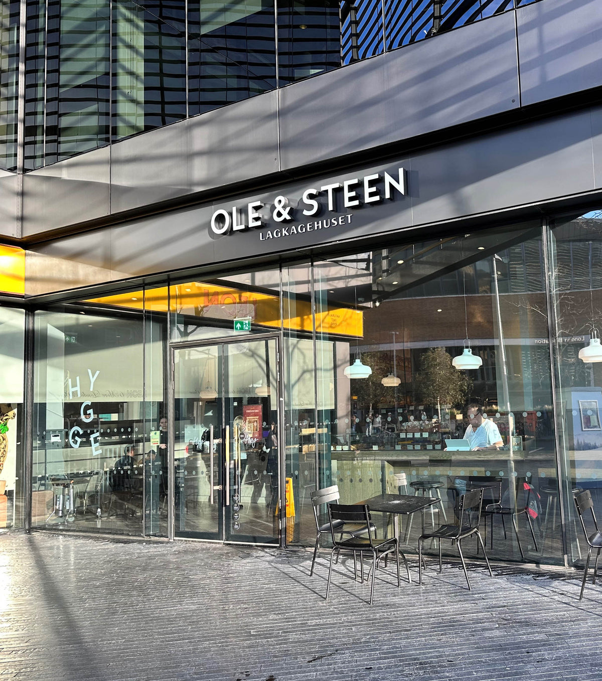 External grade light reflective silver window film applied to the glazed frontage of a restaurant