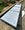 Long rectangular glass rooflight on a building exterior with garden view, with Light Reflective Silver window film applied to help reduce excess heat and glare.