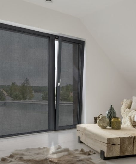 Room with large windows and cream decor, with black Fabricize fabric window film applied to provide a subtle privacy solution