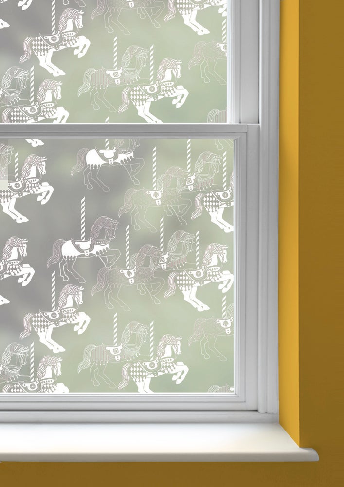 A window with Fayre's Fair patterned window film by Mini Moderns applied to both panes