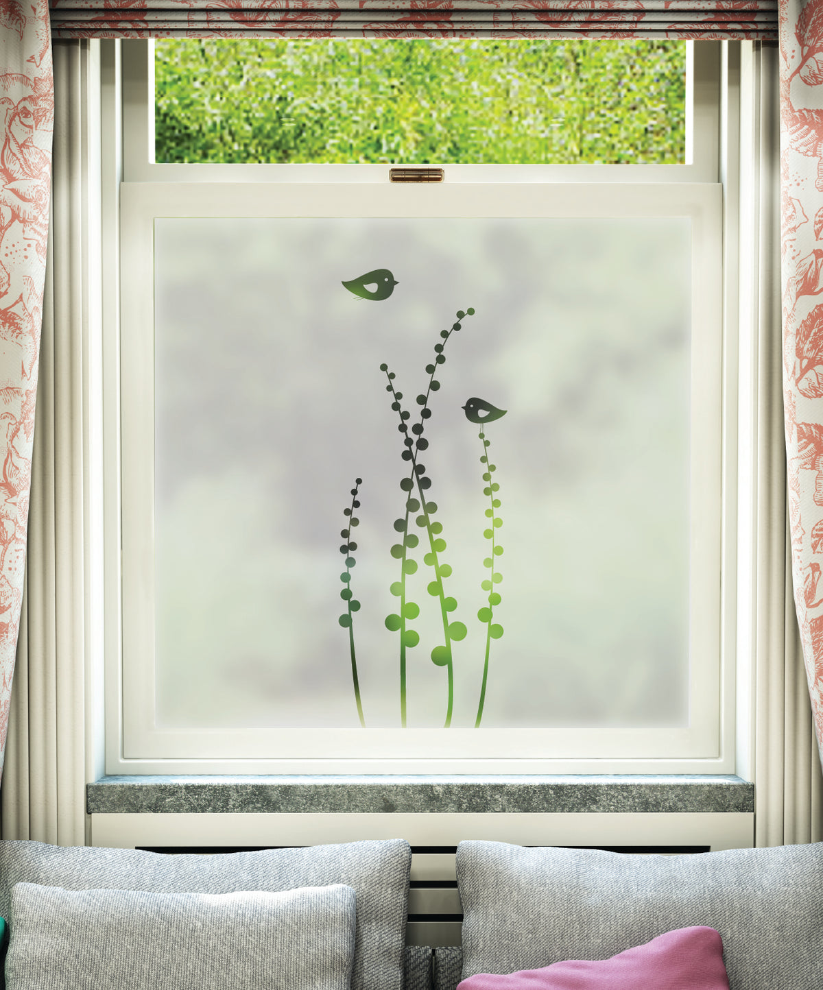 Decorative window film with plant design on a window with floral curtains.