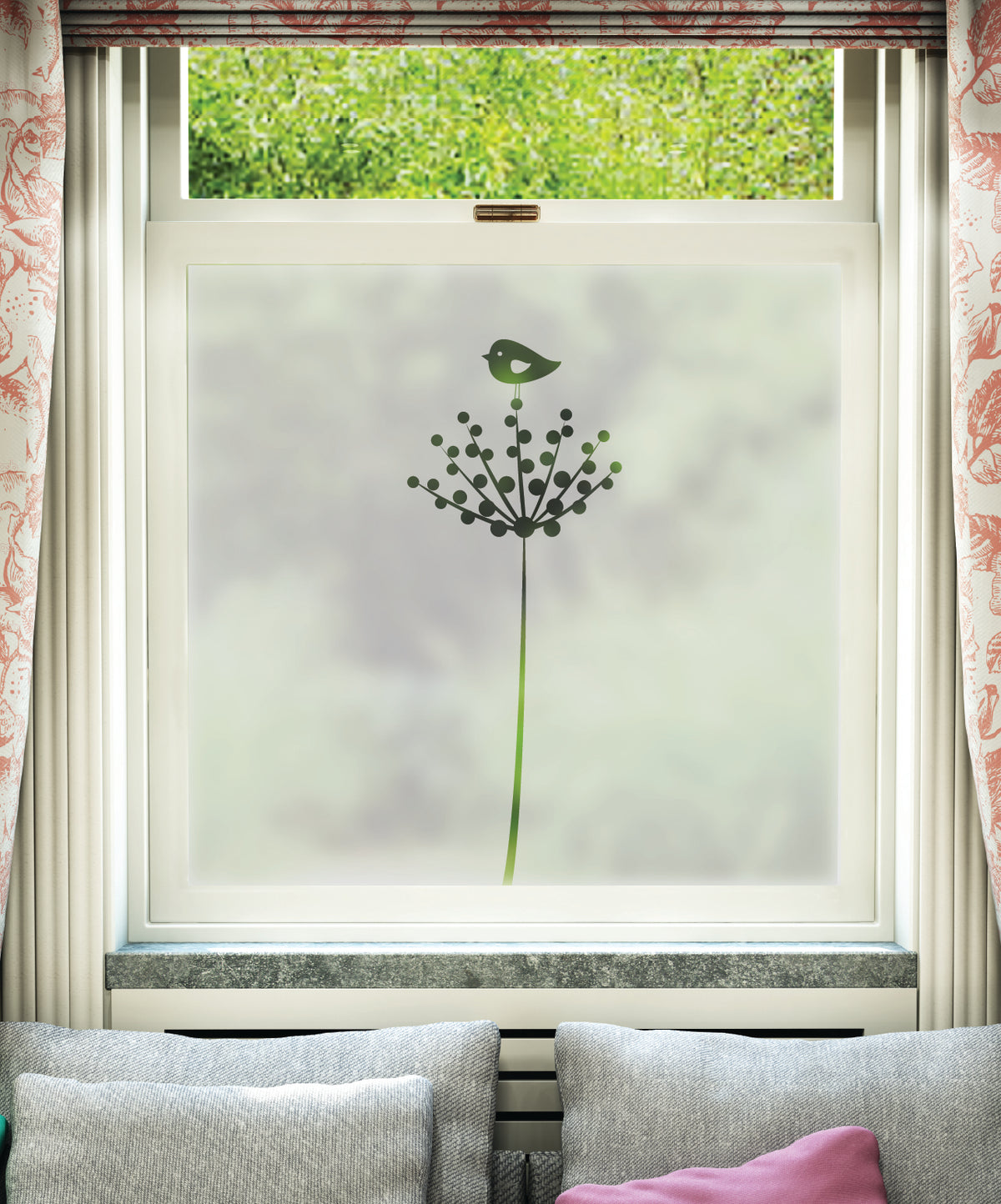 Decorative frosted window film giving the window an opaque appearance, with cut plant and bird pattern