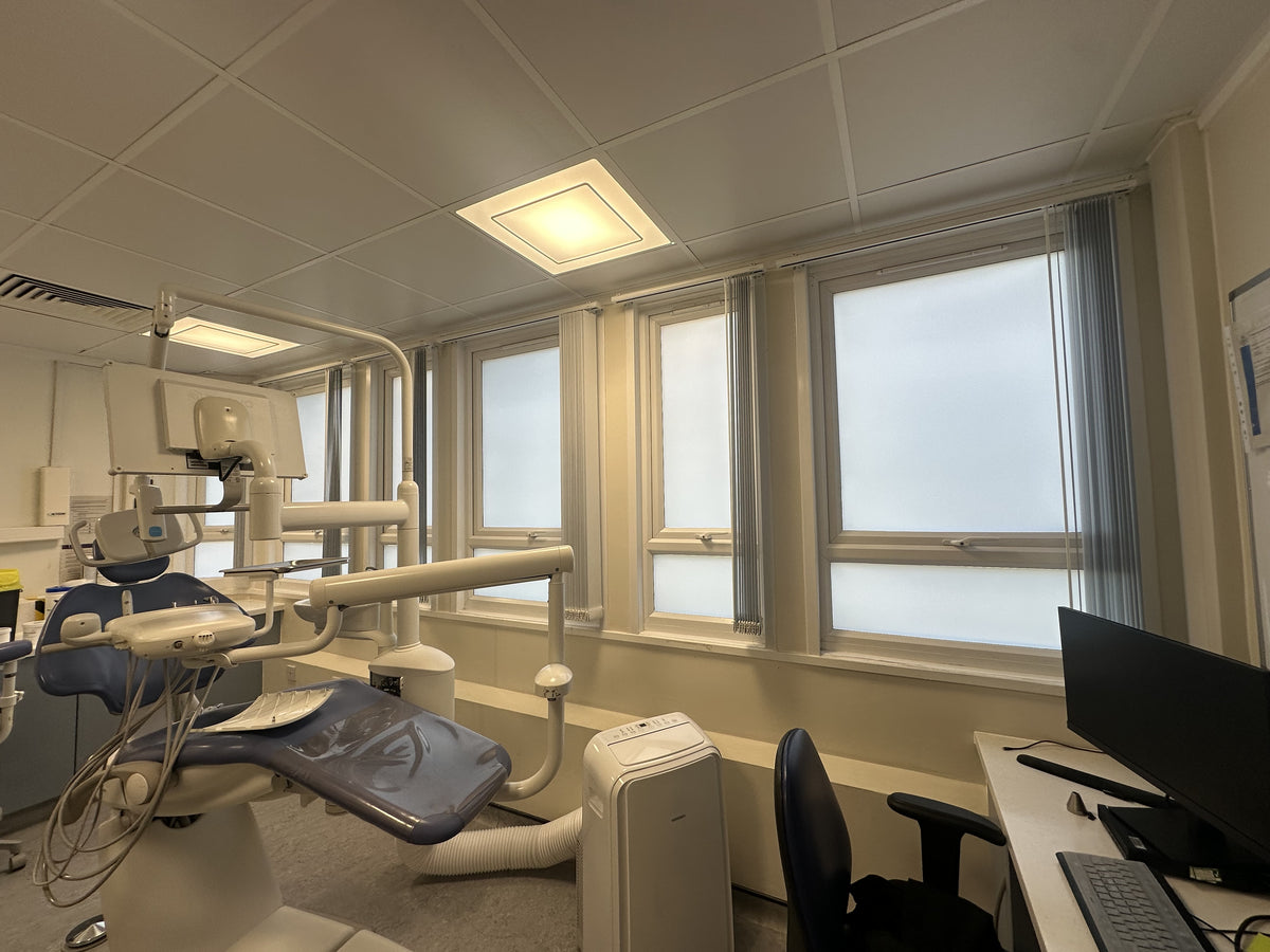 Frosted privacy film applied to the glass of a dental office.