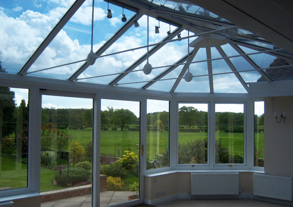 A glass conservatory which has had a solar control window film applied to the inside of the roof to reduce heat and glare.
