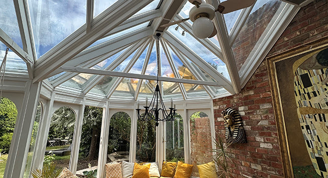 Orangery with glass roof that has had conservatory window film applied to the inside.