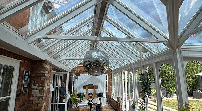 Conservatory window film applied to a glass roof to reduce glare and heat to make the room more comfortable.