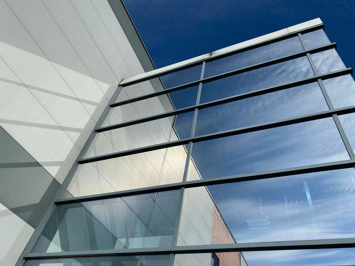 An NHS hospital which has had solar film applied to the glass facade.