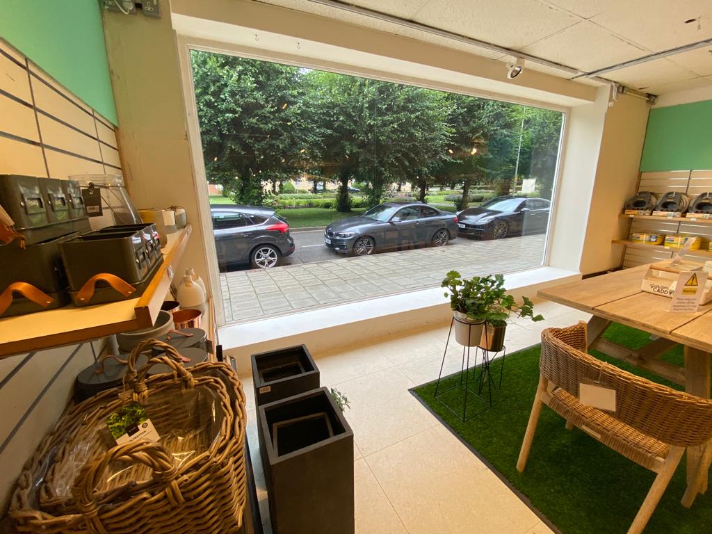 A large shop window after clear safety and security window film has been applied to the inside.