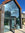 Modern glass frontage with light reflective solar control window film applied to reduce heat.