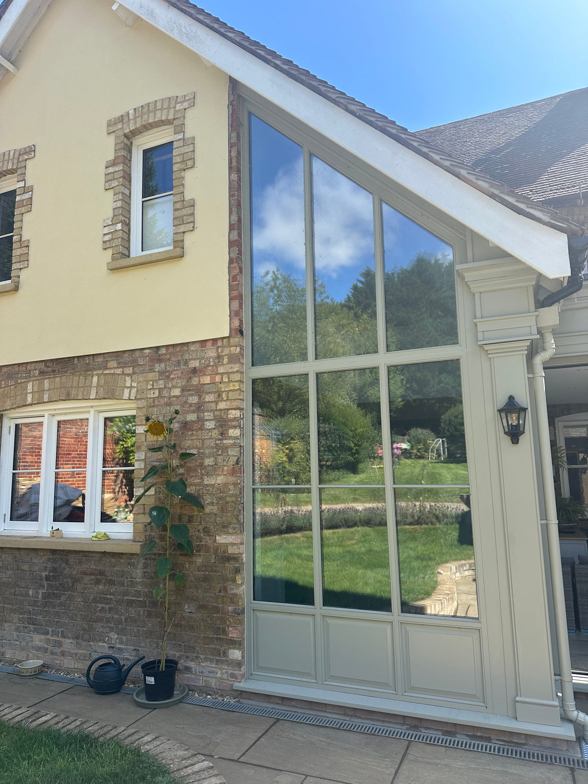 Modern home with light reflective solar control window film applied to the windows.