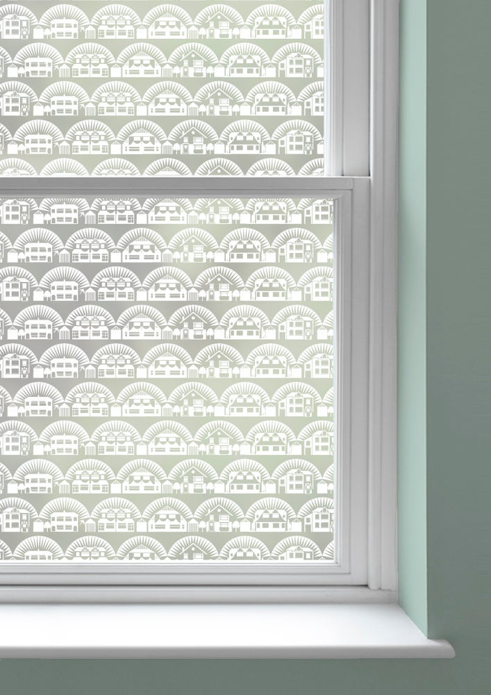 A window with Metroland patterned window film by Mini Moderns applied to both panes