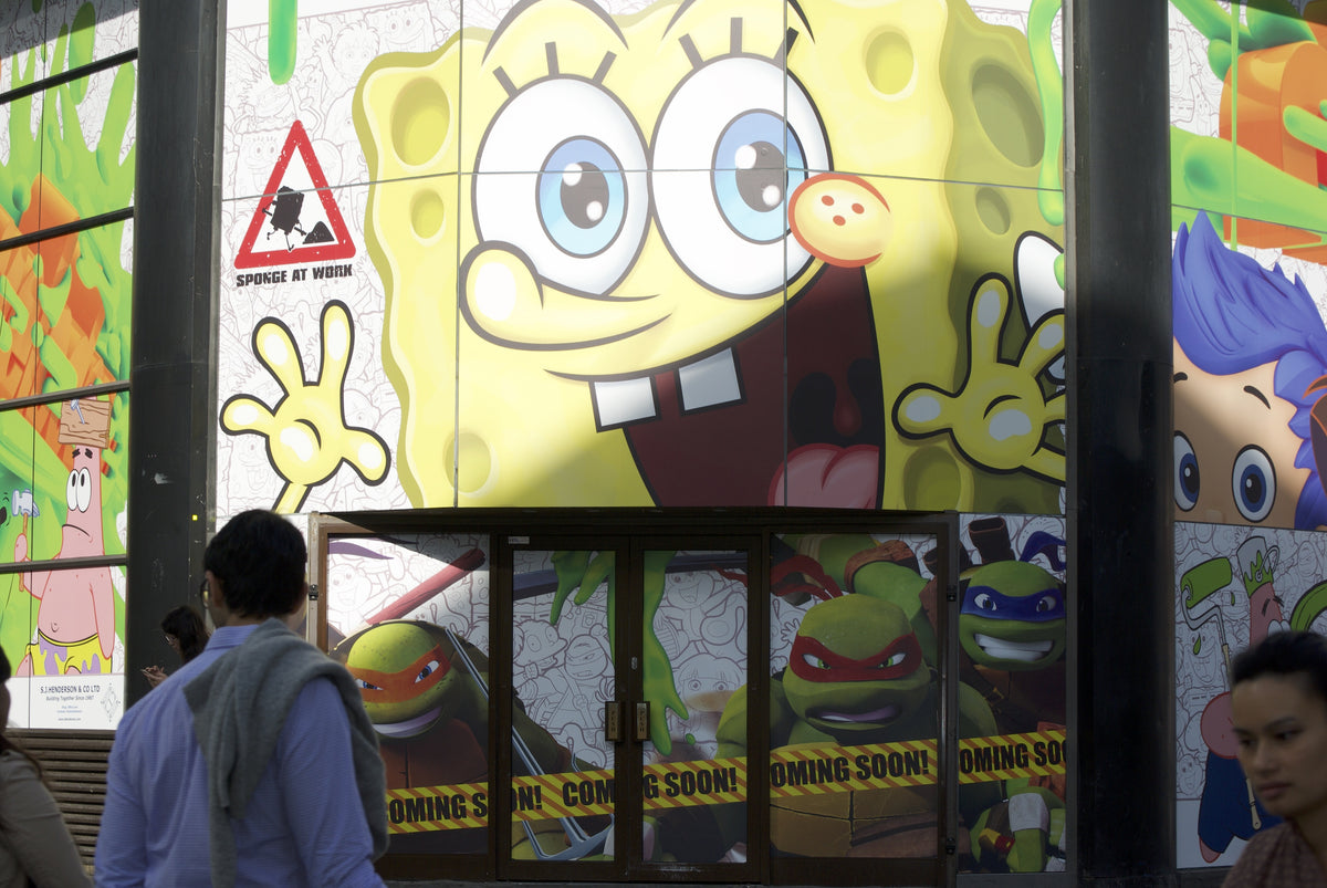 Printed window graphics applied to the outside of shop windows.