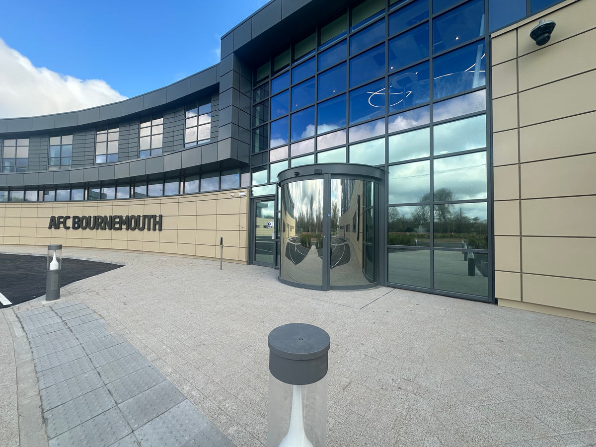 External view of the AFC Bournemouth training facility with a large glass frontage; the glazing has heat and glare reduction window film applied to it.  