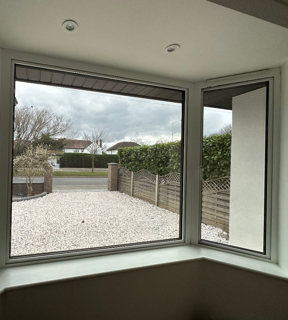 Optiview 05 solar control window film fitted to the inside of a house in a residential area.