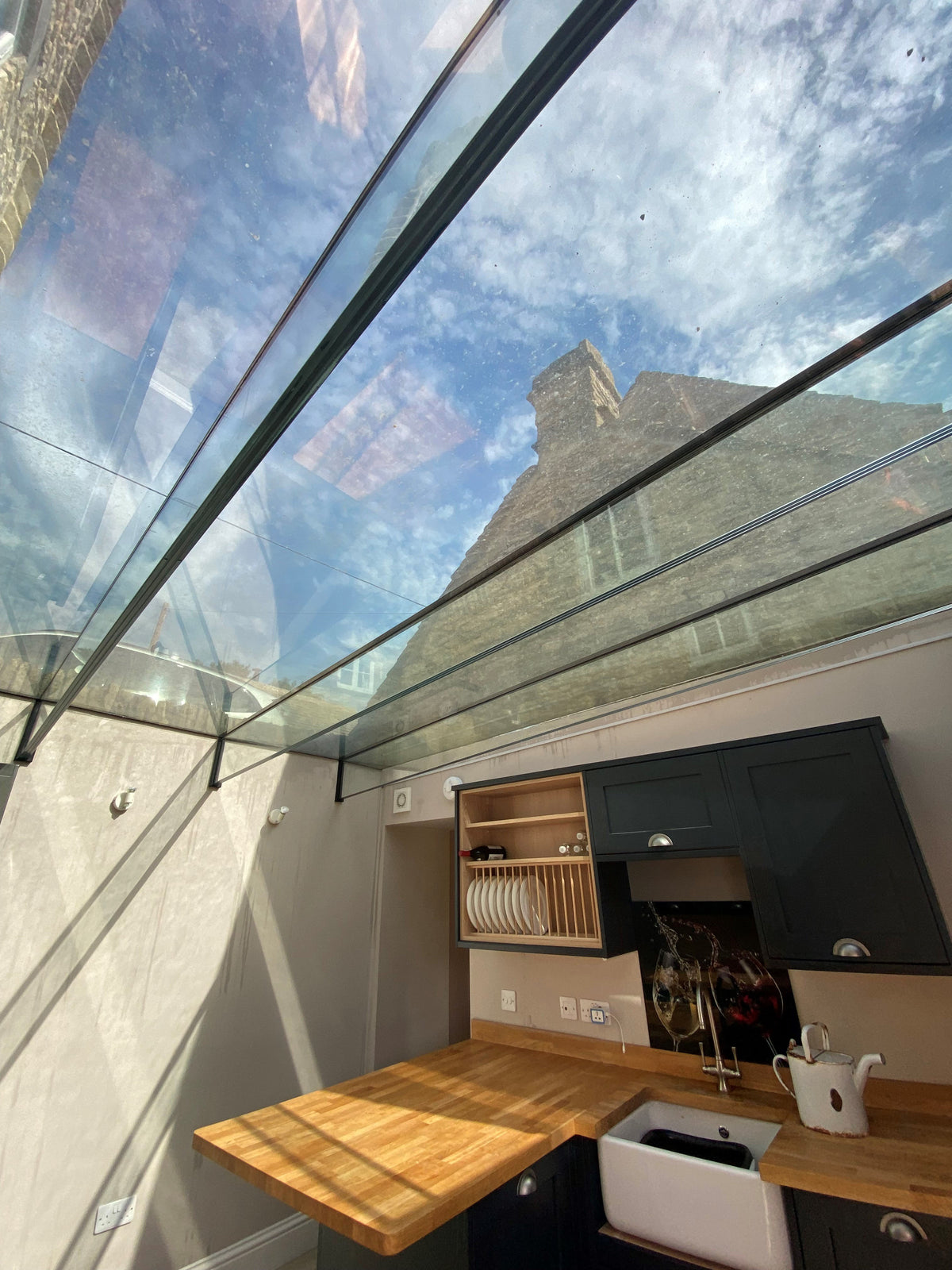 Internal view of a glass roof with Optiview 15 window applied for heat and glare reduction. 