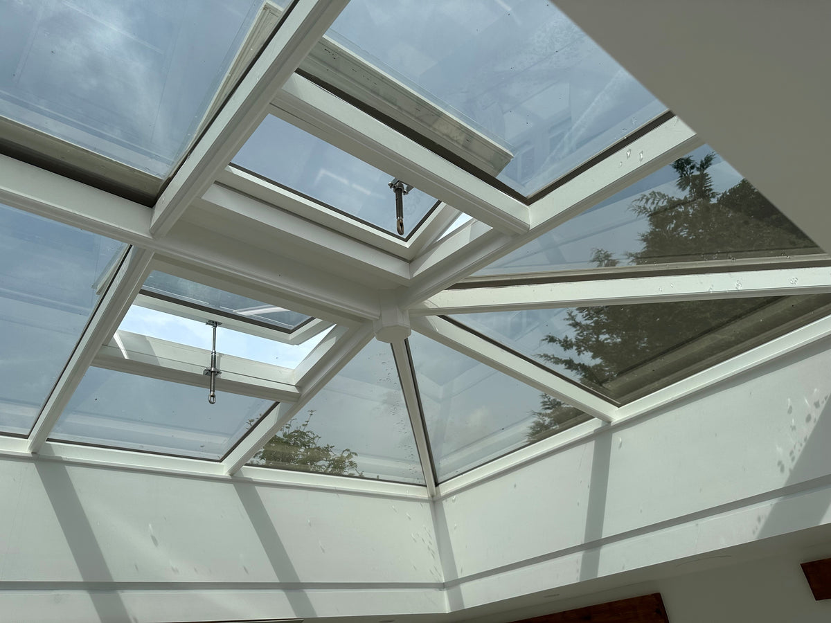 Skylight with solar control window film applied to the internal face of the glass panels on a clear day