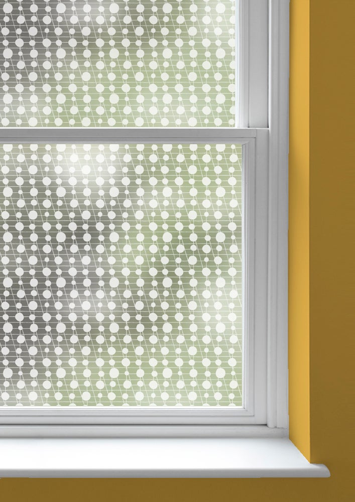 A window with Pavillion patterned frosted window film by Mini Moderns applied to both panes
