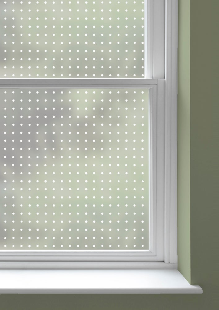 A window with Peggy patterned frosted window film by Mini Moderns applied to both panes