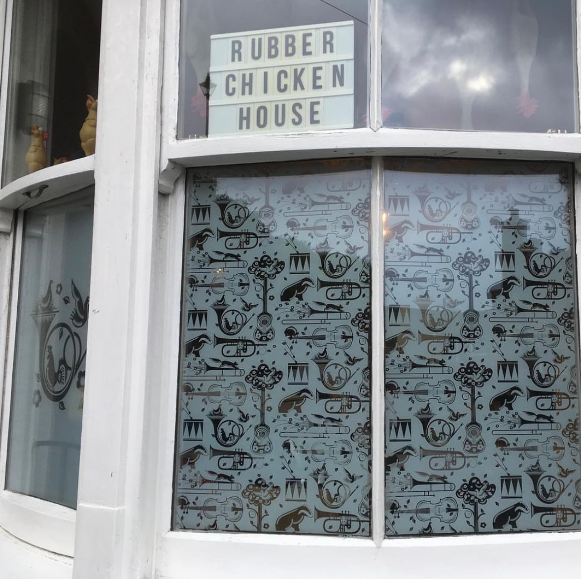 An external view of a window featuring patterned frosted window film by Mini Moderns. 