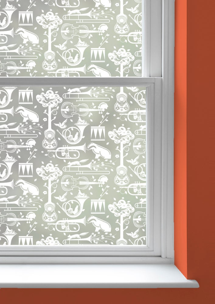 A window with Pet Sounds patterned frosted window film by Mini Moderns applied to both panes