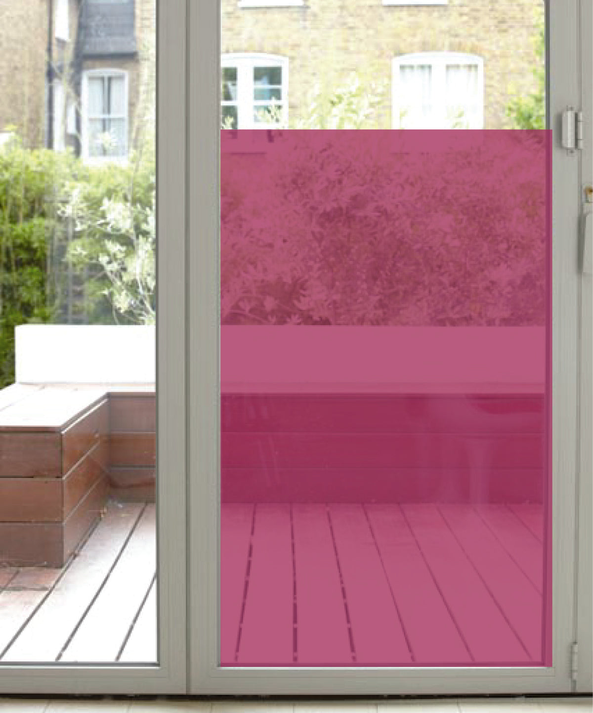 Glass door with magenta coloured transparent rainbow window film applied to the glazing