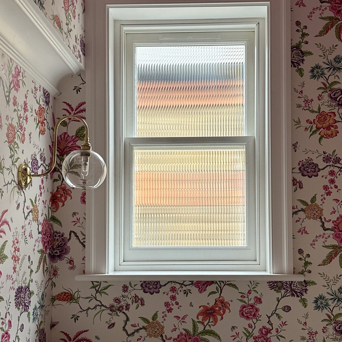 A small with in a bathroom which has had Evoke reeded window film applied to give privacy and add decoration.