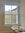 Reeded window film applied to the lower glass panels of a sash window in a bathroom.