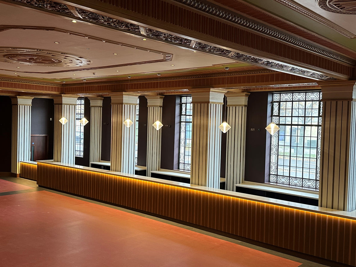 Windows in an art deco style setting which have had window film applied to the glass to protect it.