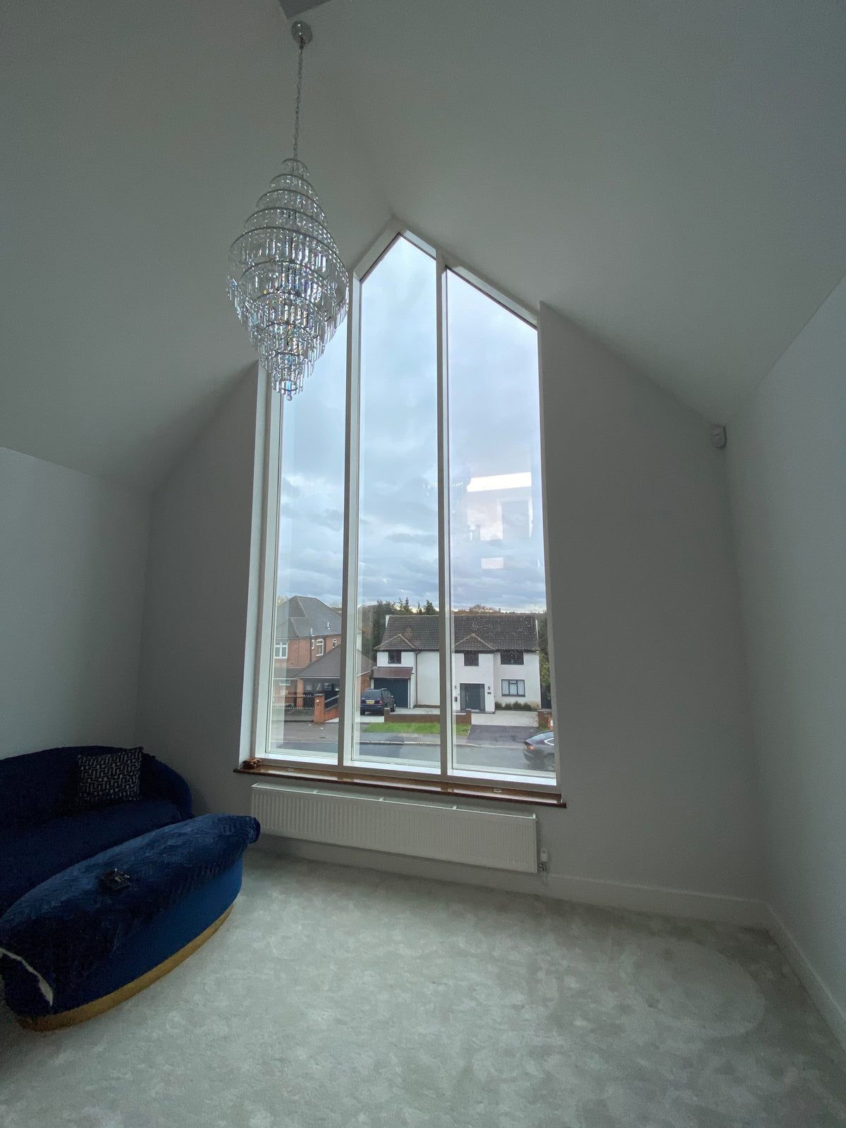The internal view out through a large shaped window which has had a solar control window film applied to the glazing.