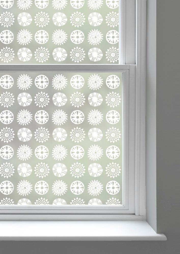 A window with Solstice patterned window film by Mini Moderns applied to both panes
