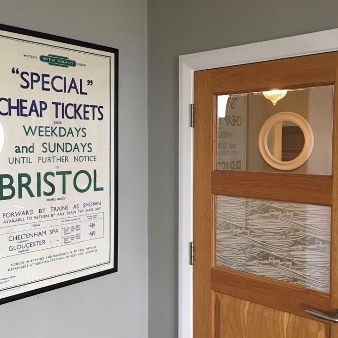 An internal shot of a wooden door with glass panels, with printed window film applied to the middle pane. 