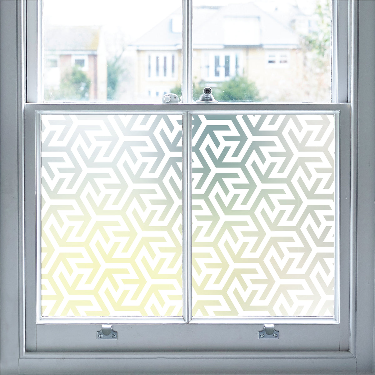 Close-up of Angulos geometric white printed frosted window film pattern.